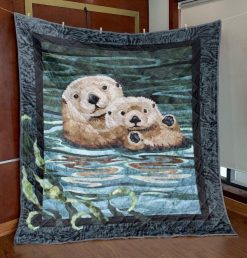 Baby Sea Otter Couple On The Water Quilt Blanket